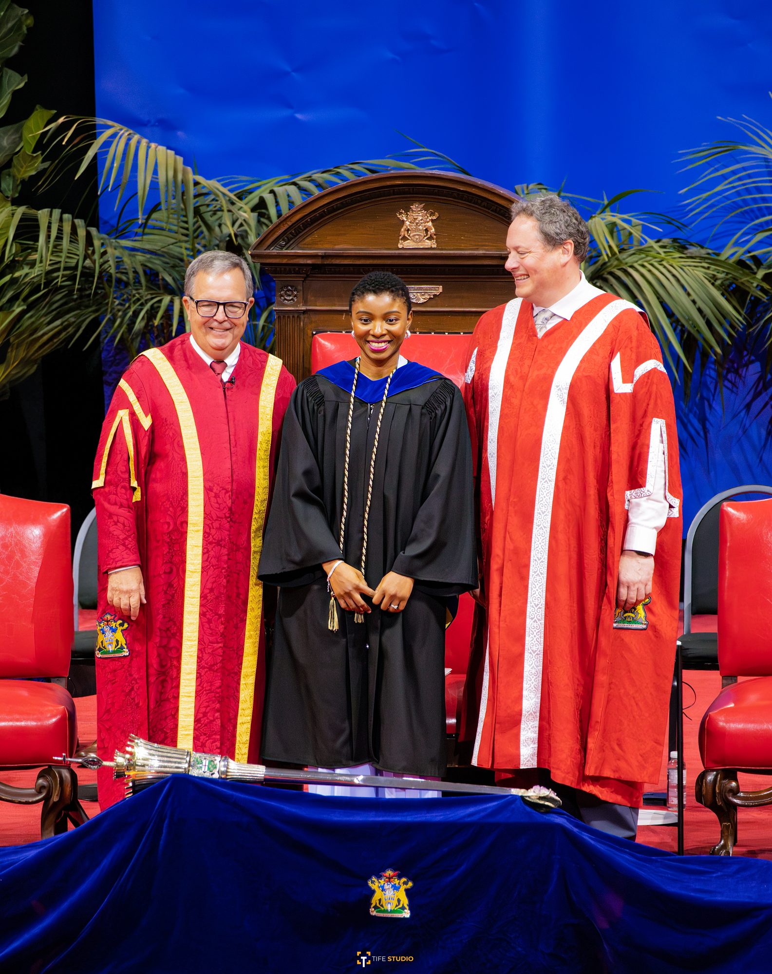 Graduate receiving diploma on stage